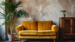 Yellow velvet loveseat sofa, wooden cabinet and potted houseplant against venetian stucco wall. Scandinavian home interior design of modern living room