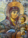 Fototapeta  - An icon with the weeping Mother of God. The icon of the Virgin Mary with the baby Jesus in her arms, with tears of myrrh flowing from her eyes 