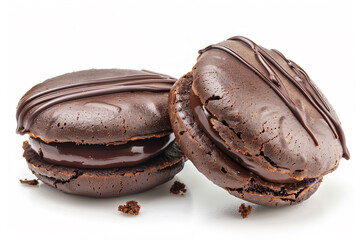 Wall Mural - two chocolate macarons with chocolate frosting on a white surface