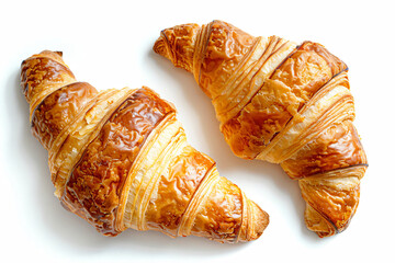 Wall Mural - two croissants are on a white surface