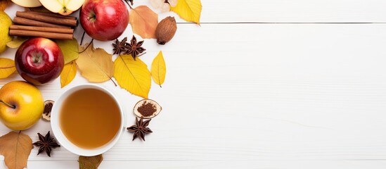 Aufkleber - Top view of a cup of tea adorned with lemon honey autumn leaves and apples placed on a white background This flat lay image captures the essence of autumn with ample copy space for any desired text