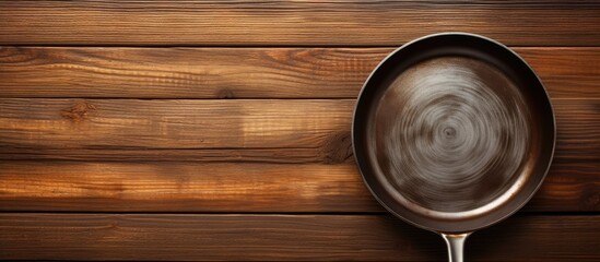 Poster - A copy space image of a grill pan placed on a wooden table as a background