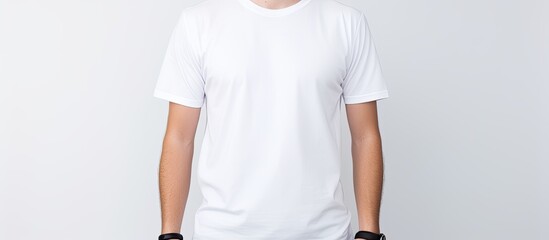 Poster - Front view of a man wearing a clean white and black t shirt standing alone against a white background Perfect for use as a copy space image