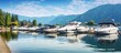 A lakeside marina with a picturesque view of cabin cruiser yachts providing a perfect copy space image