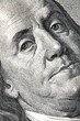 High resolution macro image of Benjamin Franklin on the one hundred US Dollar bill. Selective focus on eyes.