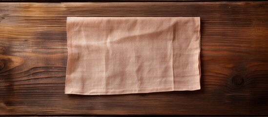 Aufkleber - Copy space image of a cloth napkin resting on a rustic wooden surface creating an inviting backdrop for adding text or messages