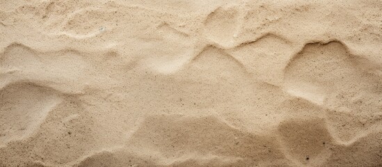 Wall Mural - A background image featuring a close up shot of a textured sand floor ideal for use as a copy space image