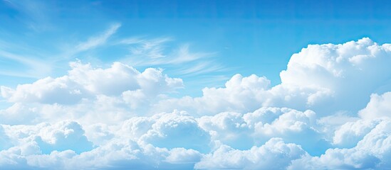 Canvas Print - A picturesque scene with fluffy white clouds gracefully floating across the azure sky creating a copy space image 102 characters