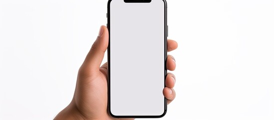 Fototapete - A young man s hand holding a smartphone with a blank screen creating a copy space image against a white background