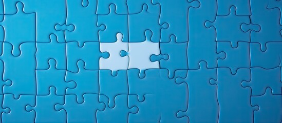 Poster - Texture photo with copy space image of a folded white jigsaw puzzle on a blue plastic surface