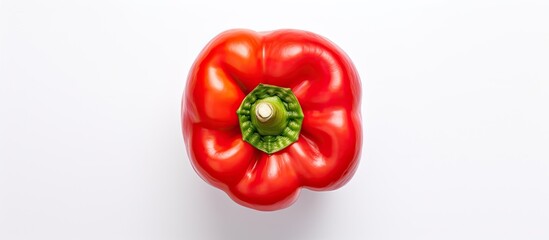 Poster - Top view of a red sweet bell pepper isolated on a white background creating a perfect copy space image for your text with a flat lay composition