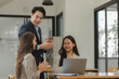 © Chadaporn - folks of businesspeople smiled with satisfaction because of they achieved their goal which is signing a contract with a major client, sharing the happiness from business success