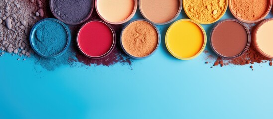 Poster - Colorful eye shadows arranged in a flat lay composition on a vibrant background providing ample copy space for text