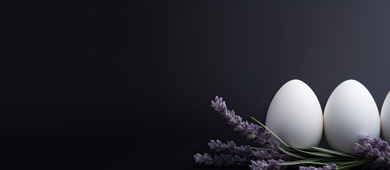 Aufkleber - A view from above shows three white Easter eggs resting on a dark background with lavender creating a visually appealing copy space image