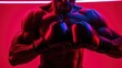 Close-up portrait of male boxer on ultraviolet neon background