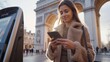 Young woman using smartphone for e-euro transactions in europe