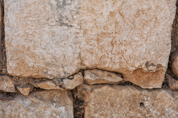 Wall Mural - Ancient wall background with old concrete bricks