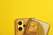 Smartphone with silicone protective case on a yellow background