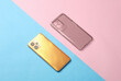 Yellow Smartphone with silicone protective case on blue pink background