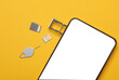 Phone mockup with white screen and SIM and micro SD card tray on yellow background