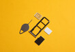 Tray with SIM and micro SD memory cards on a yellow background