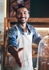 Poster - Man, portrait and cafe for handshake offer, business owner and confident for customer service. Male person, welcome and thank you for hospitality in meeting, coffee shop and proud of recruitment