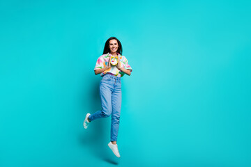 Sticker - Photo of nice positive crazy woman dressed stylish print shirt hold watch clock isolated on cyan color background