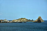 Fototapeta  - Rocky islet on the Cyclops coast on the island of Sicily