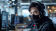 © Peece - the callcenyer guy wreaing mask and headphone working at office,