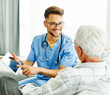 nurse doctor senior care tablet computer technology showing caregiver help assistence retirement home nursing elderly man insurance