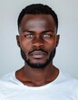 © Maelgoa - ID Photo for Passport : African adult man with straight short black hair and blue eyes, short beard, without glasses and wearing a white t-shirt