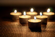 Close up of burning candles dark background
