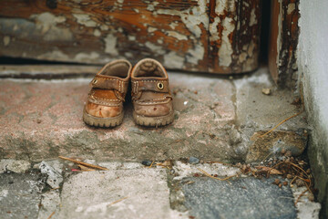 The image of a childs small shoes at the doorstep, a reminder of the innocence that deserves protection and care 