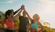 © peopleimages.com - Friends, group and high five or outdoor exercise on mountain for trail running, support or fitness. Men, women and hand gesture for training goals or sport target or celebration, morning or nature