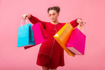 Wall Mural - attractive happy smiling stylish woman holding shopping bags