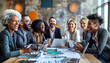 © Kateryna - of a diverse group of businesspeople laughing together around a boardroom table, with digital devices and paperwork in front of them, Diverse team, businesspeople, multicultural pe