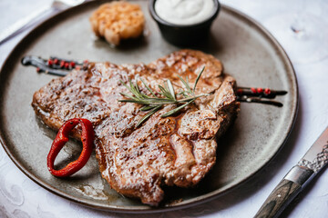 Wall Mural - Beef steak served with red wine for dinner at a restaurant.