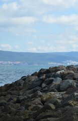 Wall Mural - Stone mountain near the sea and rocks on the coast