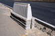 Stack of plastic road barriers by the road