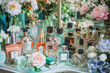 Spring Beauty Bonanza Sale: Elegant Display of Perfumes and Makeup Amidst Flowers