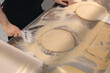 Pizzamaker stretches dough, worker preparing fresh food pizza. Business pizzeria concept