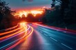 © Larisa AI - The image captures a scenic highway as the sun sets, with long exposure creating dynamic light streaks on the road