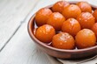 Gulab jamun is an Indian sweet made of thick, smooth sugar syrup that covers round balls of flour and milk. 