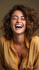 Canvas Print - Joyful young woman laughing with eyes closed