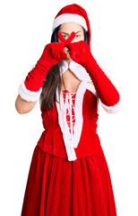 Poster - Young beautiful caucasian woman wearing santa claus costume rejection expression crossing fingers doing negative sign