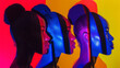 © RISHAD - Women with African descent under colored lights, showcasing vibrant, artistic expressions of identity and beauty.