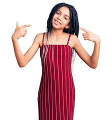 Canvas Print - Cute african american girl wearing casual clothes looking confident with smile on face, pointing oneself with fingers proud and happy.