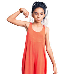 Wall Mural - Cute african american girl wearing casual clothes strong person showing arm muscle, confident and proud of power