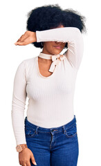 Sticker - Young african american girl wearing casual clothes and glasses covering eyes with arm, looking serious and sad. sightless, hiding and rejection concept