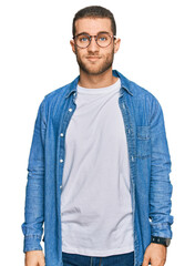 Poster - Young caucasian man wearing casual clothes relaxed with serious expression on face. simple and natural looking at the camera.